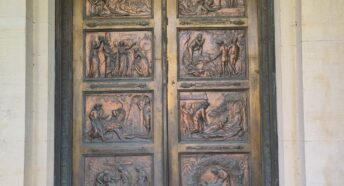 Bronze doors embossed with scenes from 'The Pilgrim's Progress'.