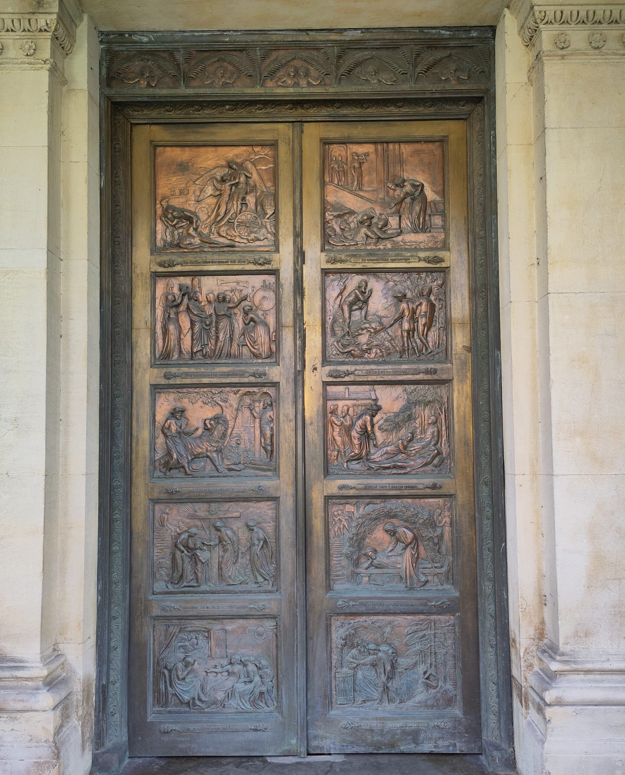 Bronze doors embossed with scenes from 'The Pilgrim's Progress'.